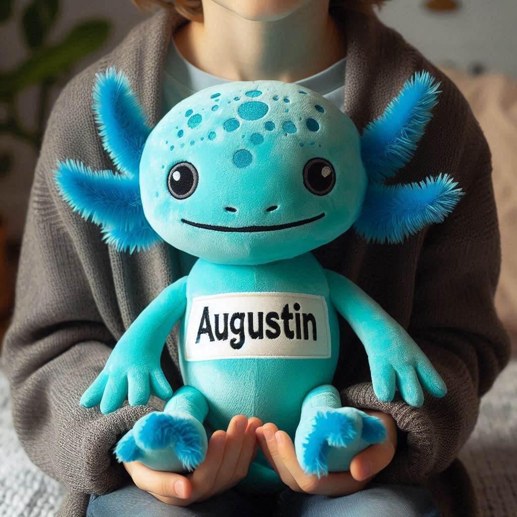 Peluche axolotl bleu turquoiqe personnalisee avec le prenom augustin dans les mains dun enfant 1 1